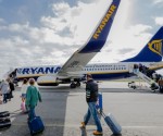 Passengers board a Ryanair flight.