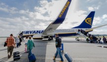 Passengers board a Ryanair flight.