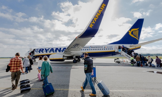 Passengers board a Ryanair flight.